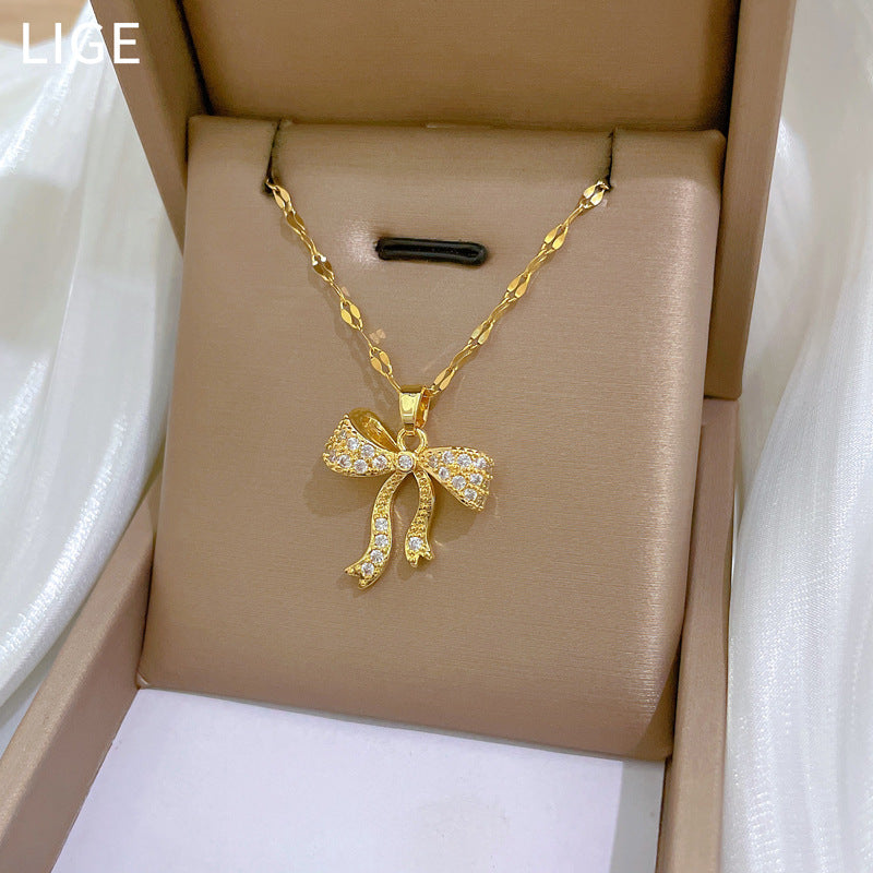 Collana con pendente di lusso con fiocco in strass per donna, girocollo delicato in acciaio inossidabile con lunghezza della catena regolabile