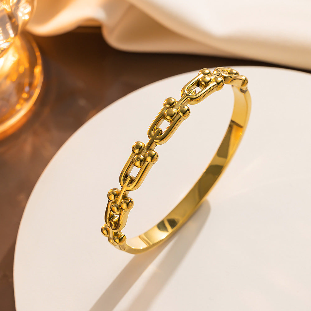 Bracciale minimalista a ferro di cavallo a U in acciaio al titanio con finitura liscia elettrolitica sottovuoto