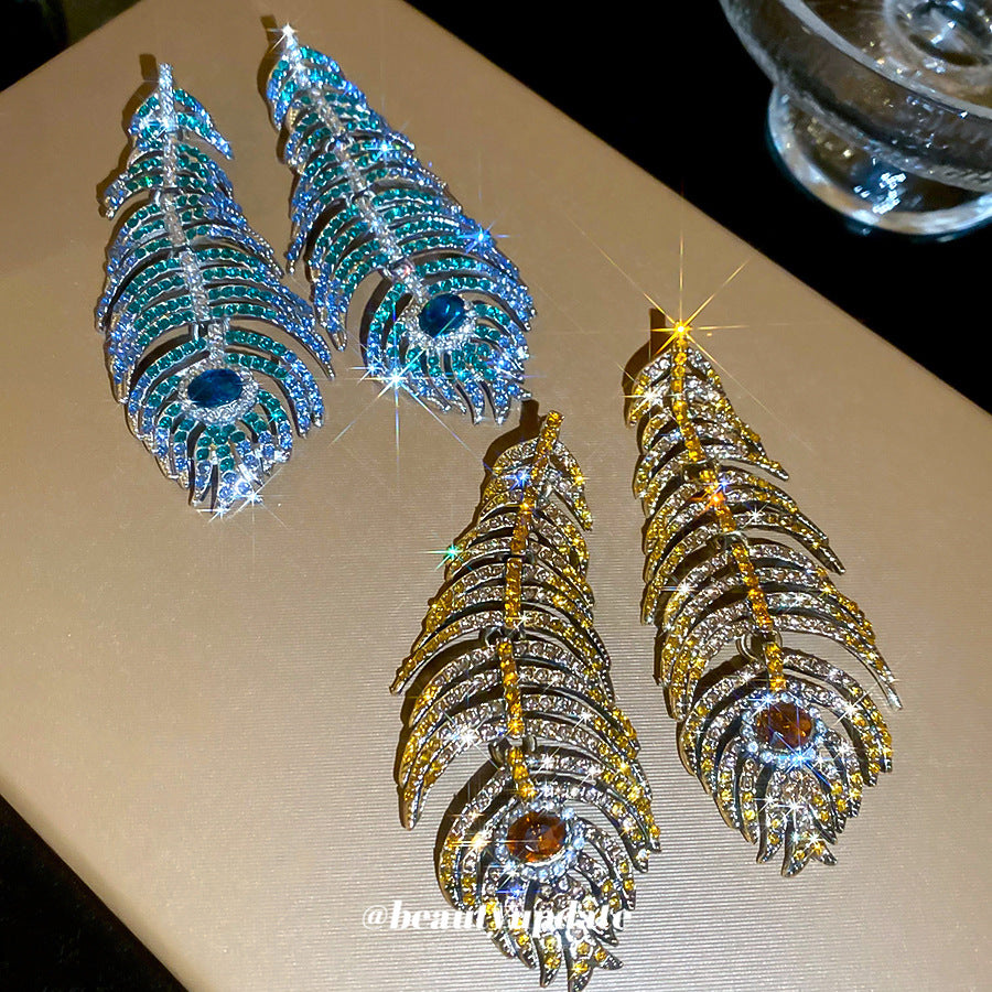 Orecchini a perno artistici vintage in lega a forma di piuma e foglia con intarsio di strass per donna