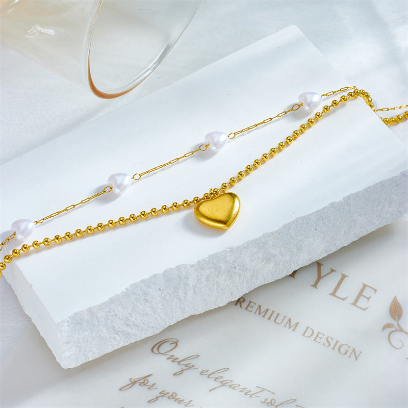Cavigliera in acciaio al titanio a forma di cuore, in stile vintage, con finitura perlata, da donna