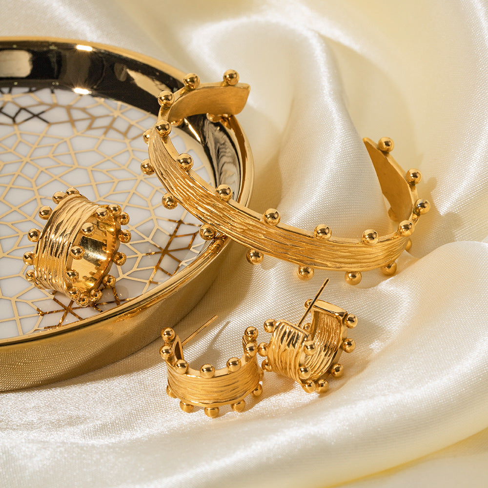 Orecchini a cerchio da donna, alla moda, placcati in oro 18 carati, in acciaio inossidabile, con grana del legno, a forma di C, geometrici e increspati