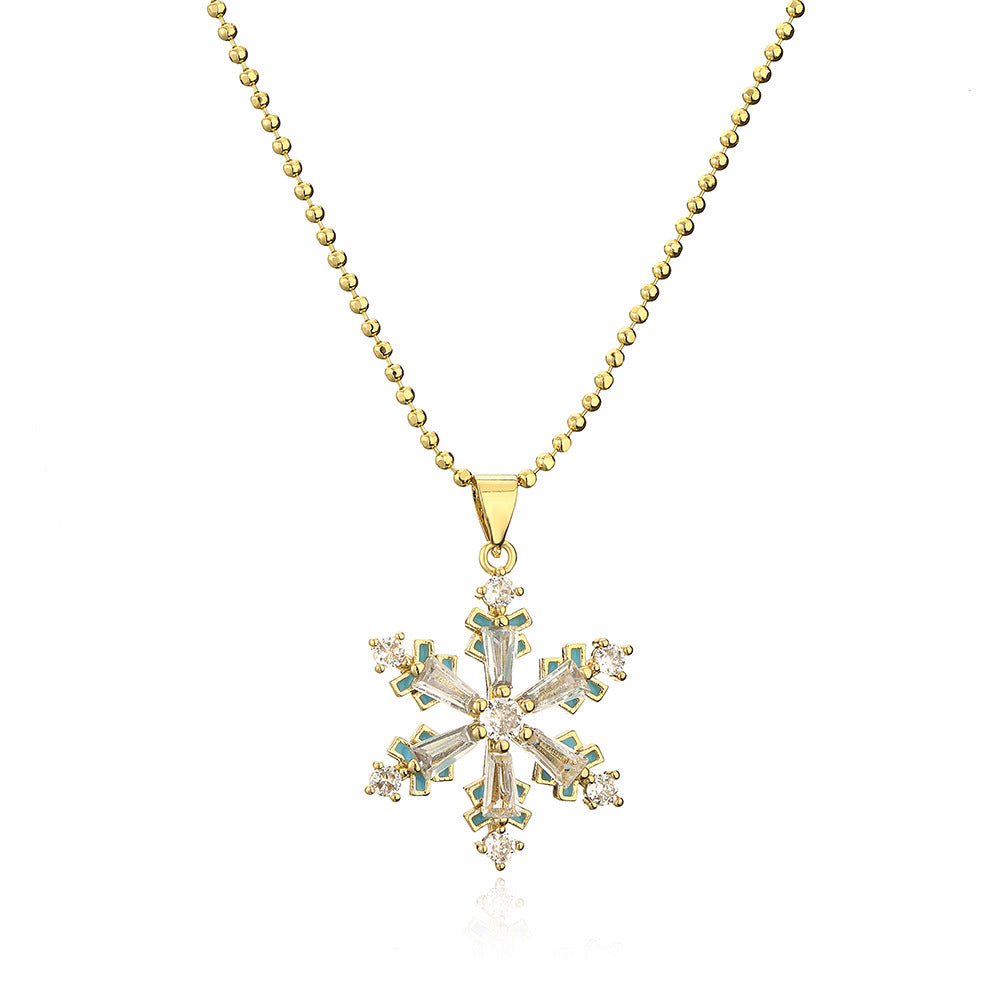 Collana con ciondolo a cuore e fiocco di neve minimalista da donna in rame con placcatura in oro vero e intarsio in zirconi
