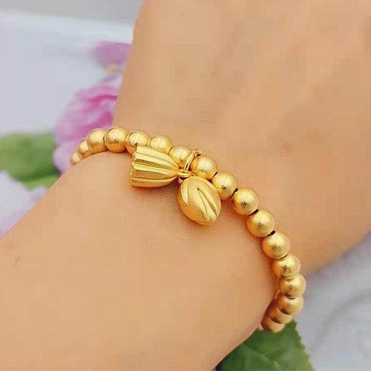 Bracciale con perline a forma di baccello e fiore di loto geometrico in stile lusso leggero, in metallo color oro e argento con cordino elastico