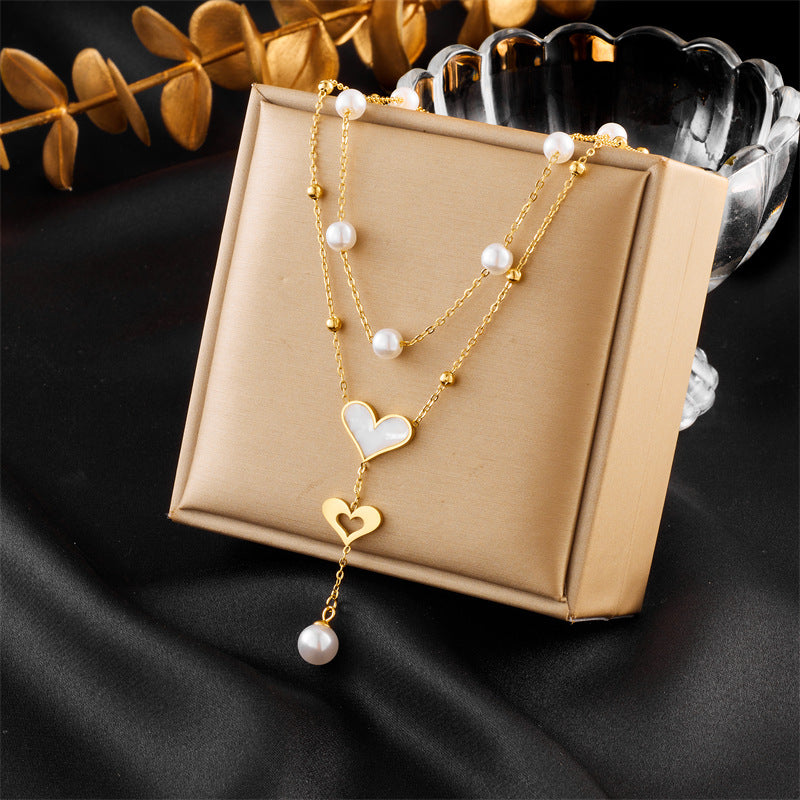 Vintage-Style Double-Layer Pendant Necklace with Pearl and Butterfly Charm, Stainless Steel Chain with Tassel Accents and Plated Finish