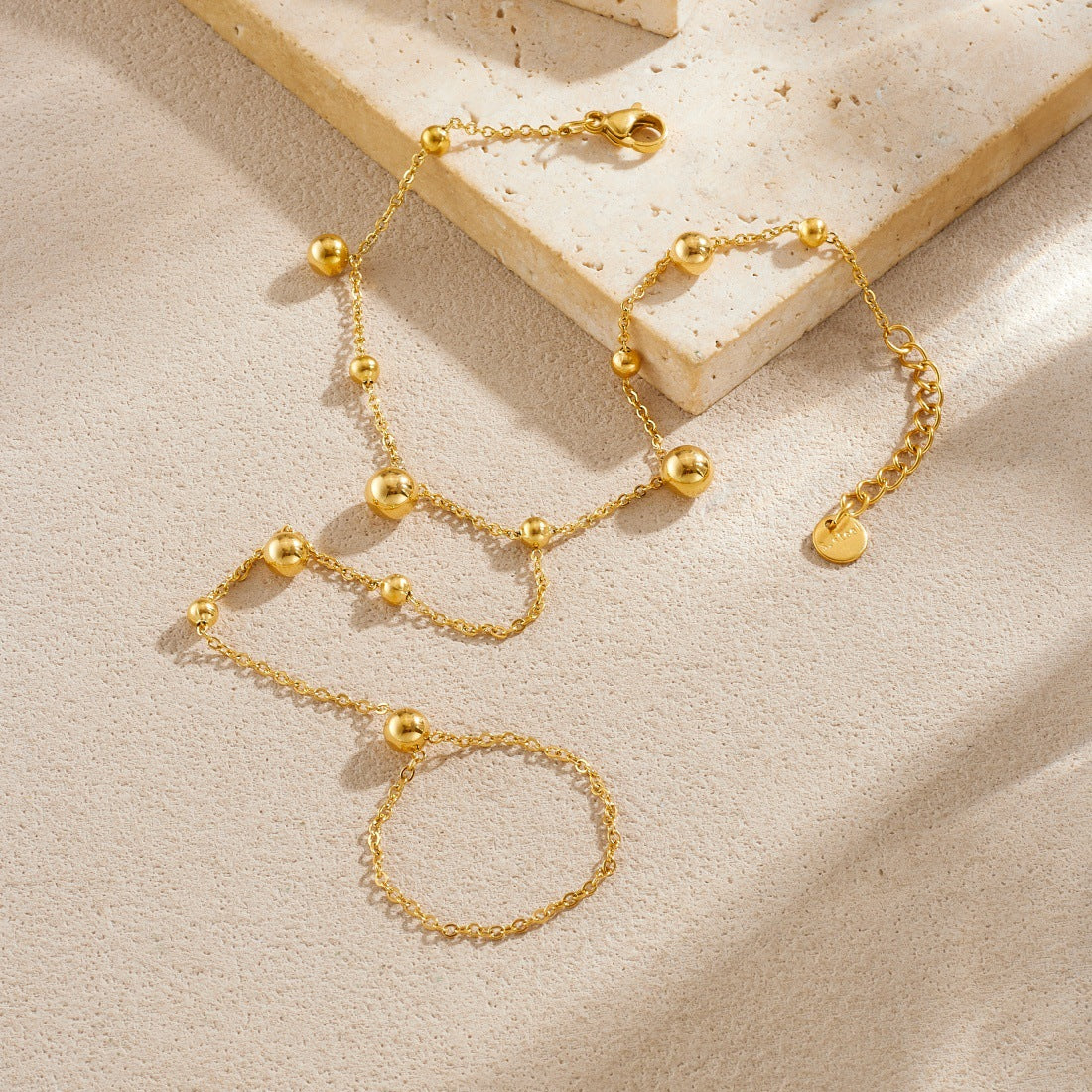 Sweet Gold Plated Stainless Steel Geometric Round Bead Long Tassel Hand Chain for Women