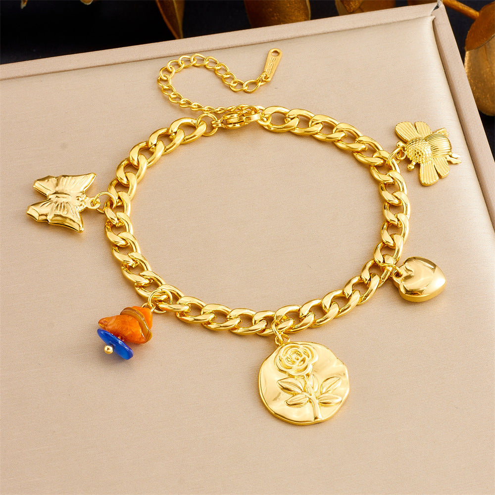 Bracciale con ciondolo floreale e a cuore in stile vintage in acciaio inossidabile con finitura placcata da donna