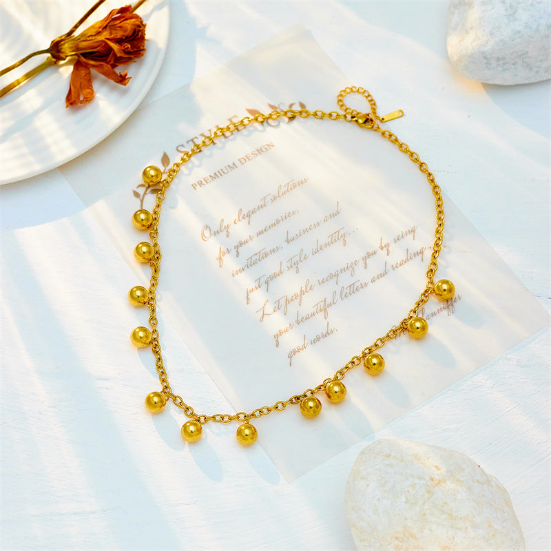Collar de acero inoxidable chapado en oro con colgante de bola retro minimalista y diseño geométrico para mujer