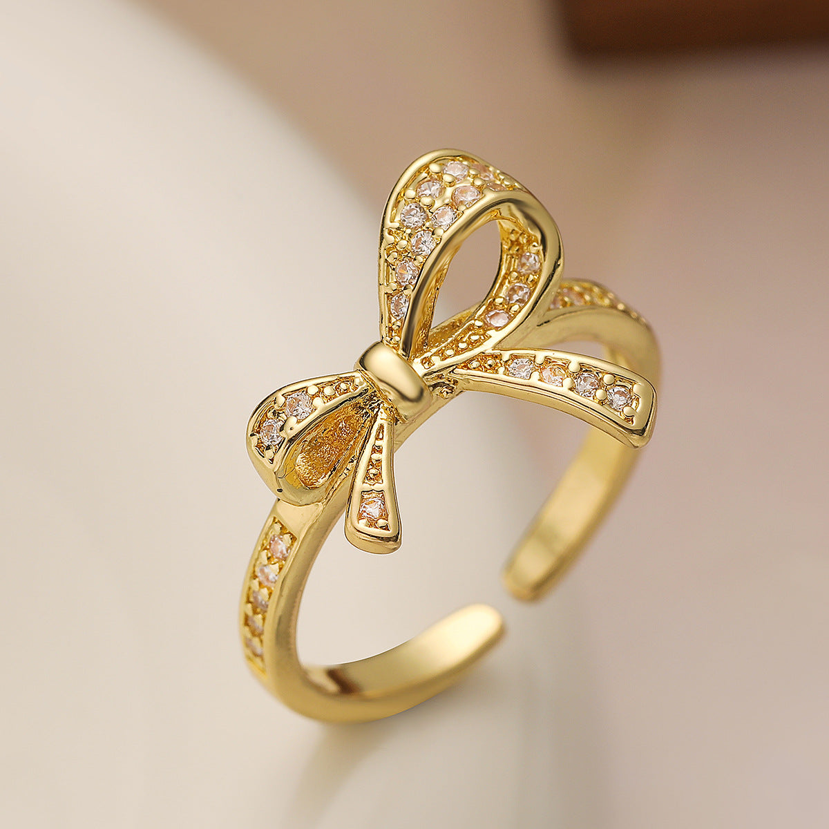 Geometric Bowknot-Shaped Opening Ring for Women in Copper with 18K Gold Plating and Cubic Zirconia Inlay
