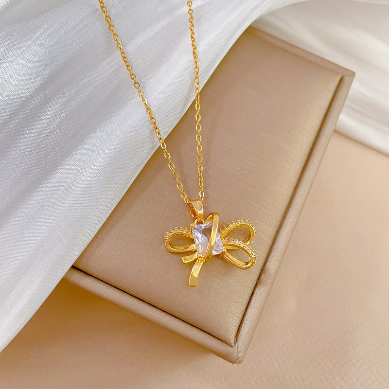 Set collana e orecchini minimalisti con fiocco in acciaio al titanio placcato per donna