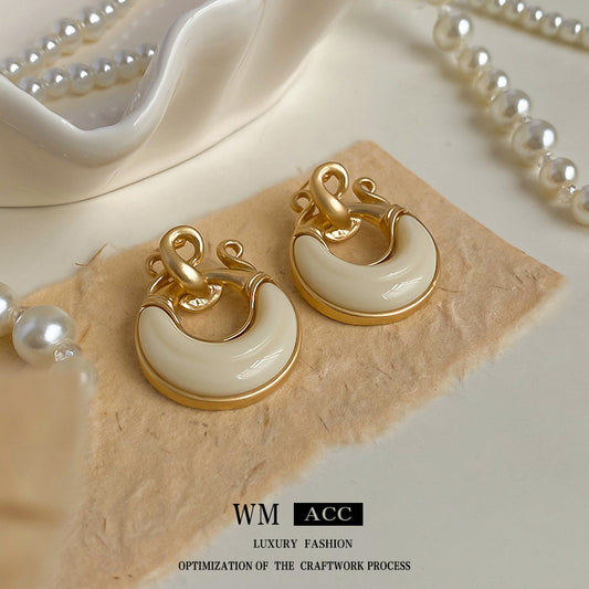 Orecchini chic in resina geometrica con design circolare cavo, base in lega placcata oro e perni in acciaio inossidabile da donna