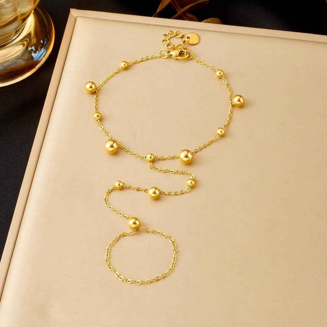 Sweet Gold Plated Stainless Steel Geometric Round Bead Long Tassel Hand Chain for Women