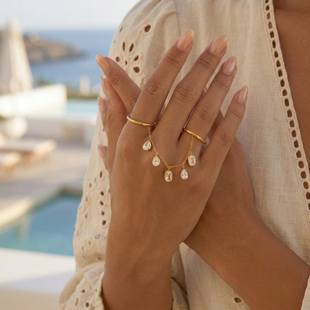 Elegant Geometric Stainless Steel Ring with Cubic Zirconia and Tassel Detail PVD Gold Plated