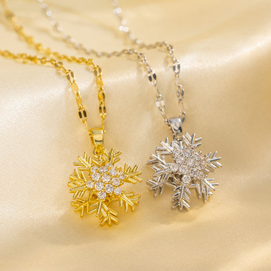 Collana con ciondolo a fiocco di neve girevole da donna in acciaio al titanio con intarsio di strass su catena ondulata