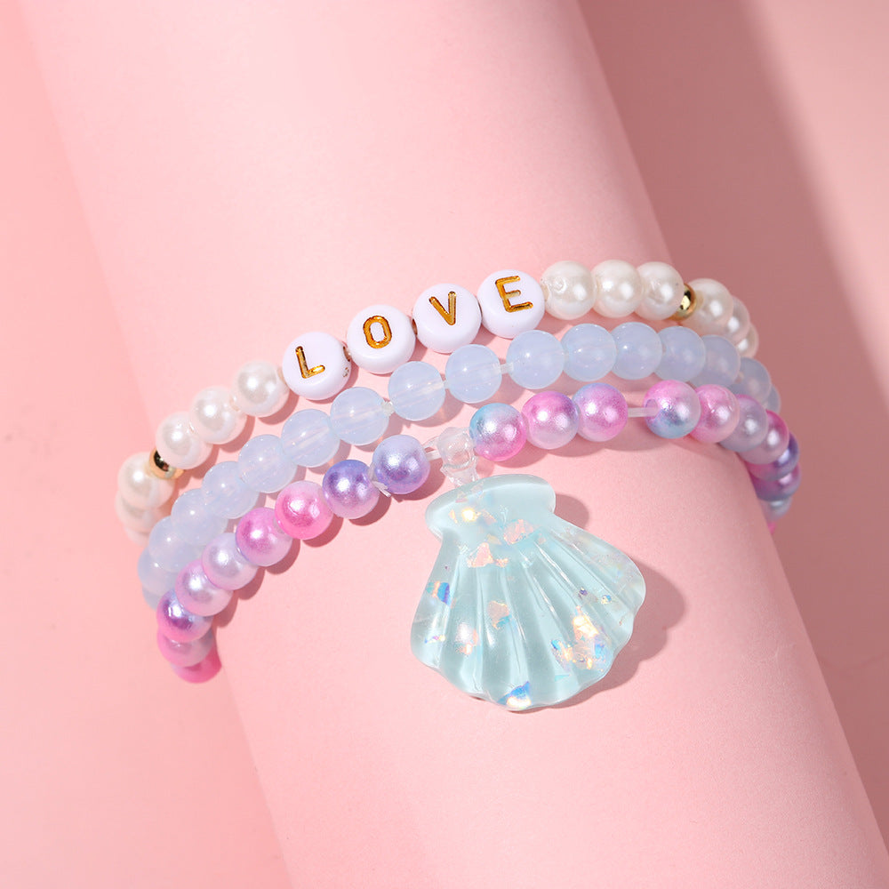 Juego de pulseras de resina con cuentas en forma de corazón estilo caricatura con dijes de cola de sirena y conchas marinas para niños
