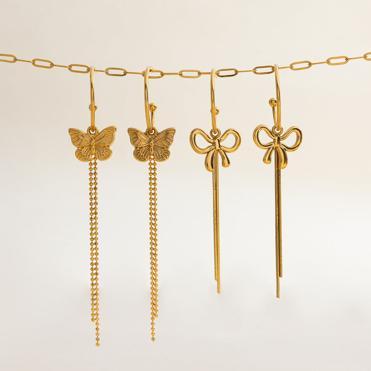 Pendientes de borla de lujo con forma de lazo de acero inoxidable para mujer con acabado chapado
