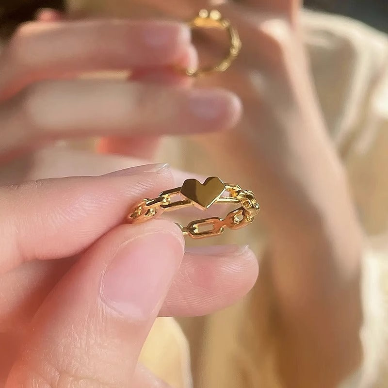 Sweet Minimalist Geometric Hollow Heart-Shaped Titanium Steel Ring with Gold Plating for Women