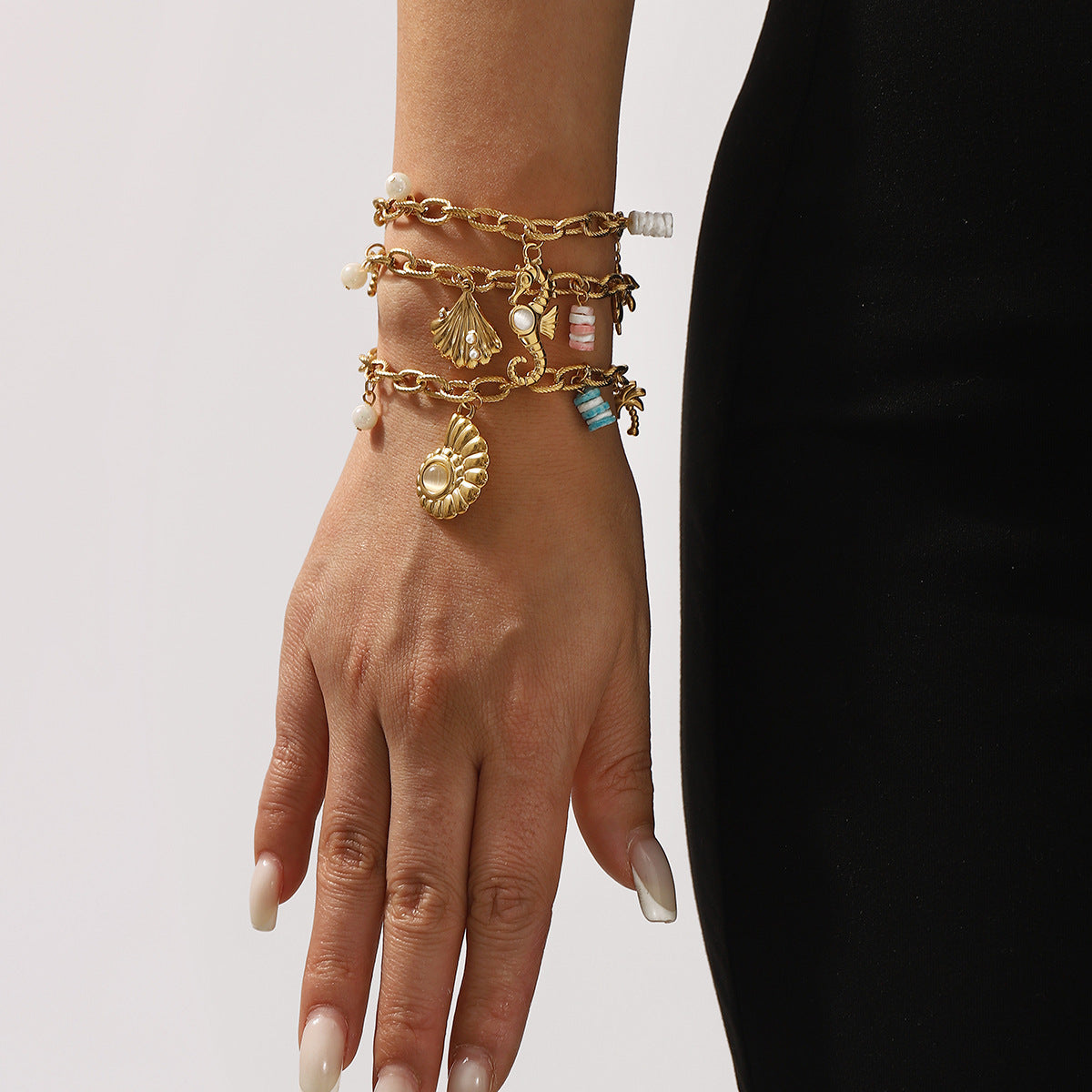 Vacation Style Seashell and Seahorse Pendant Stainless Steel Bracelet for Women with Plated Finish