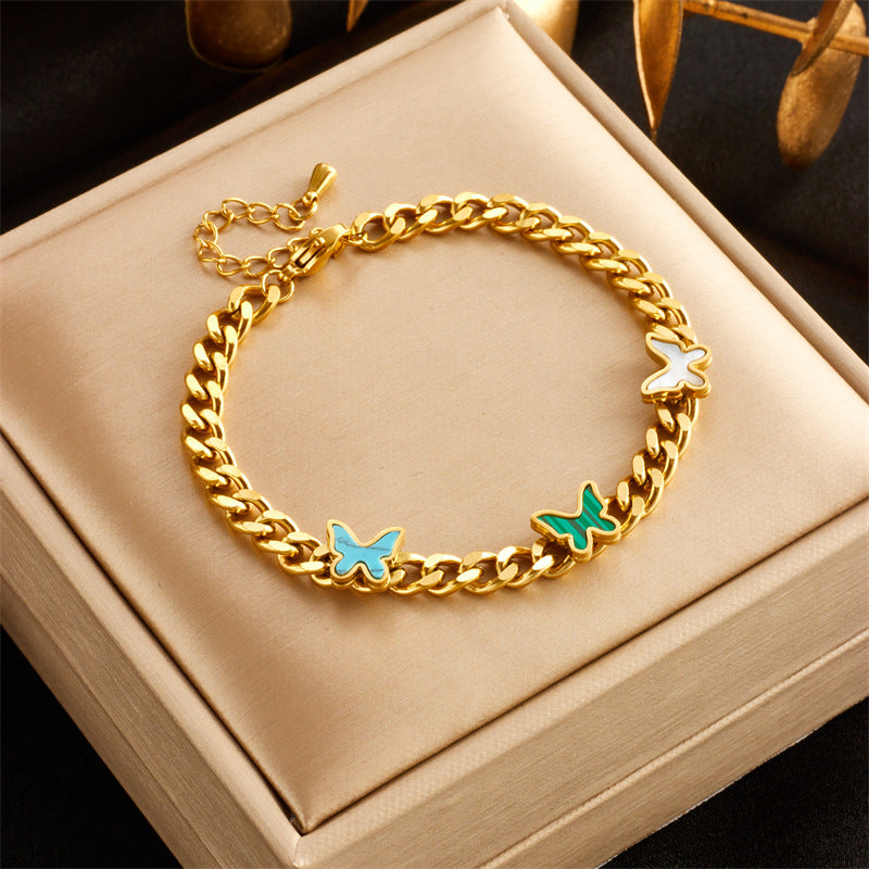 Bracciale alla moda minimalista in acciaio al titanio con ciondoli a cuore e farfalla e intarsio di strass, per donne