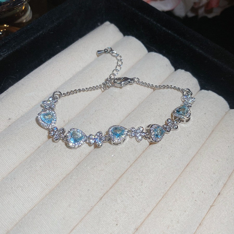 Elegante bracciale da donna con fiore geometrico e accenti in zircone, in rame placcato, stile trendy da ufficio, gioiello versatile e lussuoso per la mano