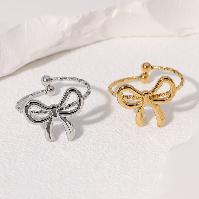 Anello da donna in acciaio inossidabile a forma di fiocco, aperto e placcato oro