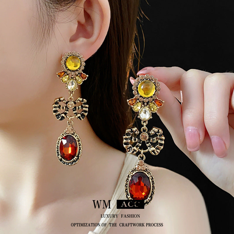 Pendientes vintage de aleación con forma de lazo e incrustaciones de diamantes de imitación con diseño geométrico ovalado para mujer
