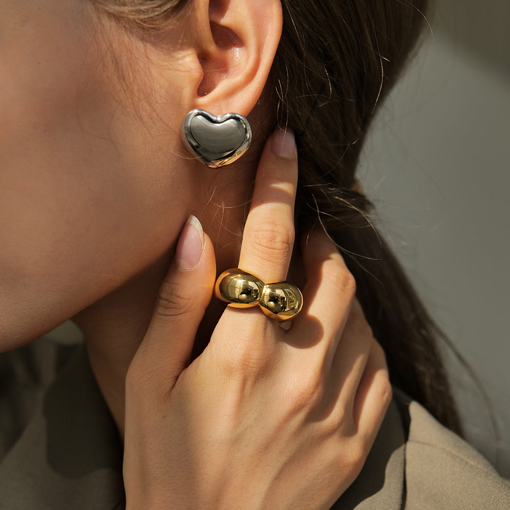 Anillo geométrico de flor hueca de acero inoxidable chapado en oro de 18 quilates de moda para mujer
