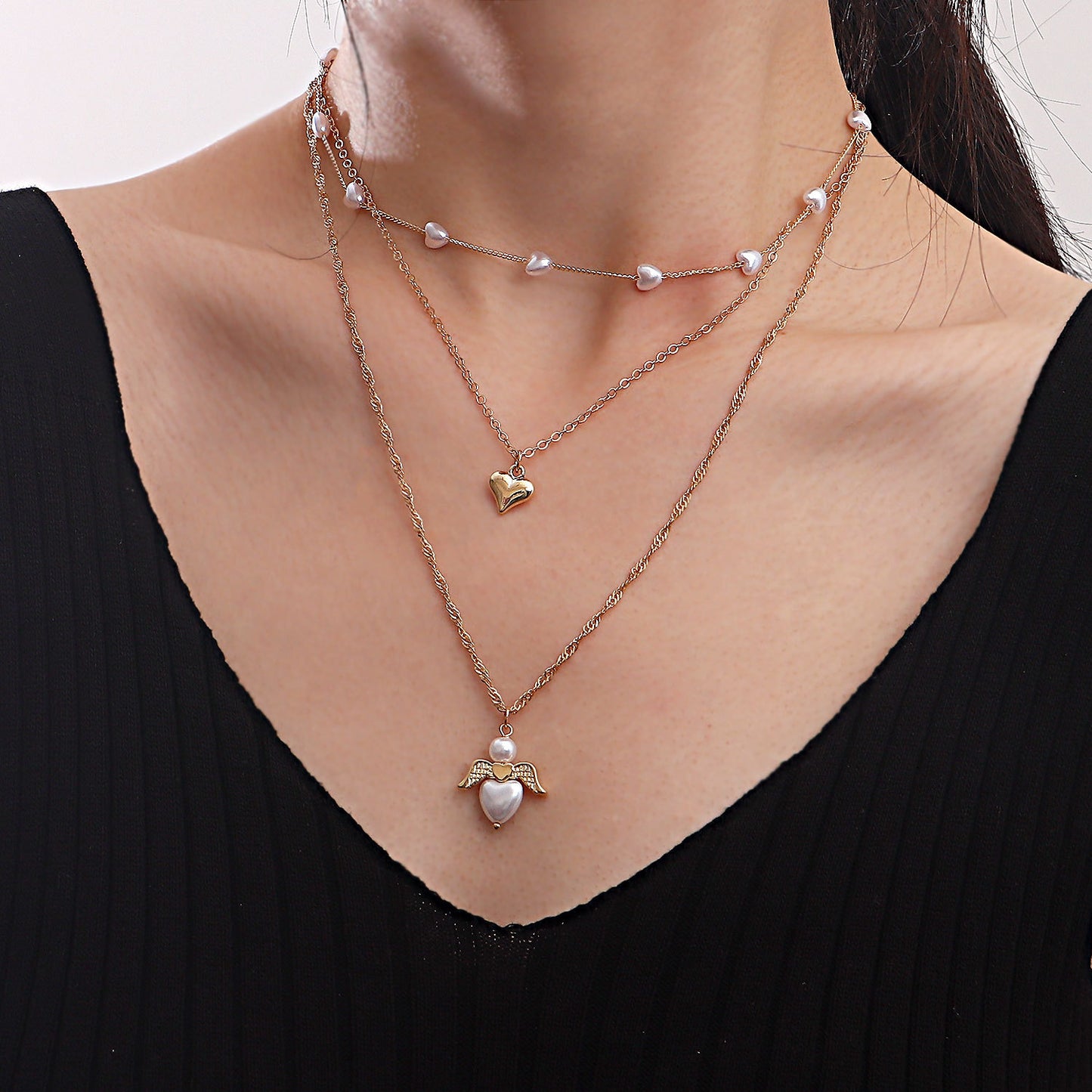 Minimalist Multi-Layer Heart-Shaped Pearl and Angel Wing Necklace for Women in Alloy with Plated Finish