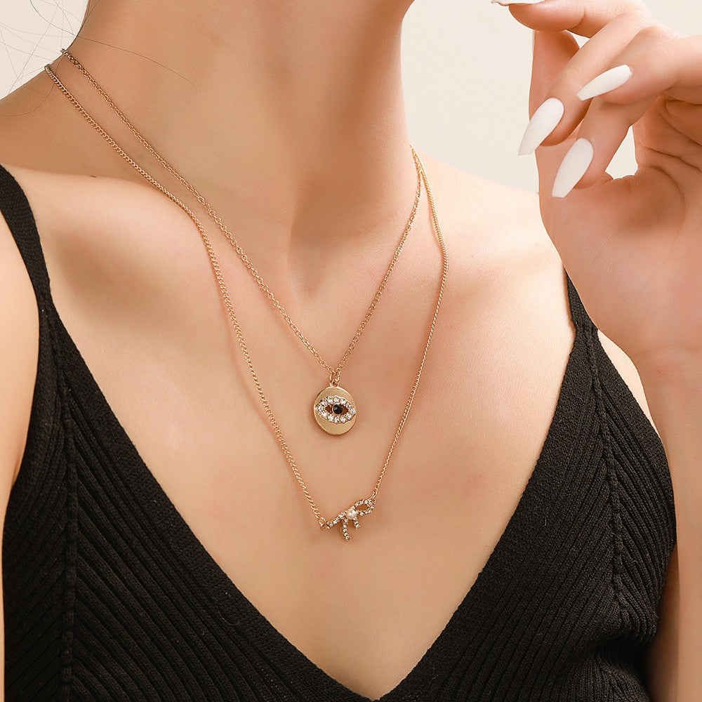 Sweet Rhinestone Inlaid Alloy Butterfly Evil Eye Bow Pendant Necklace with Curb Chain for Women