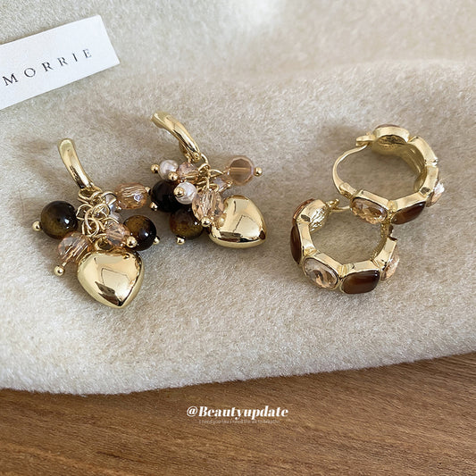 Elegantes aretes de borla con corazón geométrico de ojo de tigre e incrustaciones de diamantes de imitación para mujer