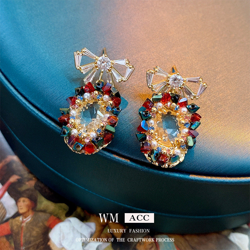 Elegantes pendientes de perlas y circonitas con forma ovalada y lazo en acero inoxidable para mujer