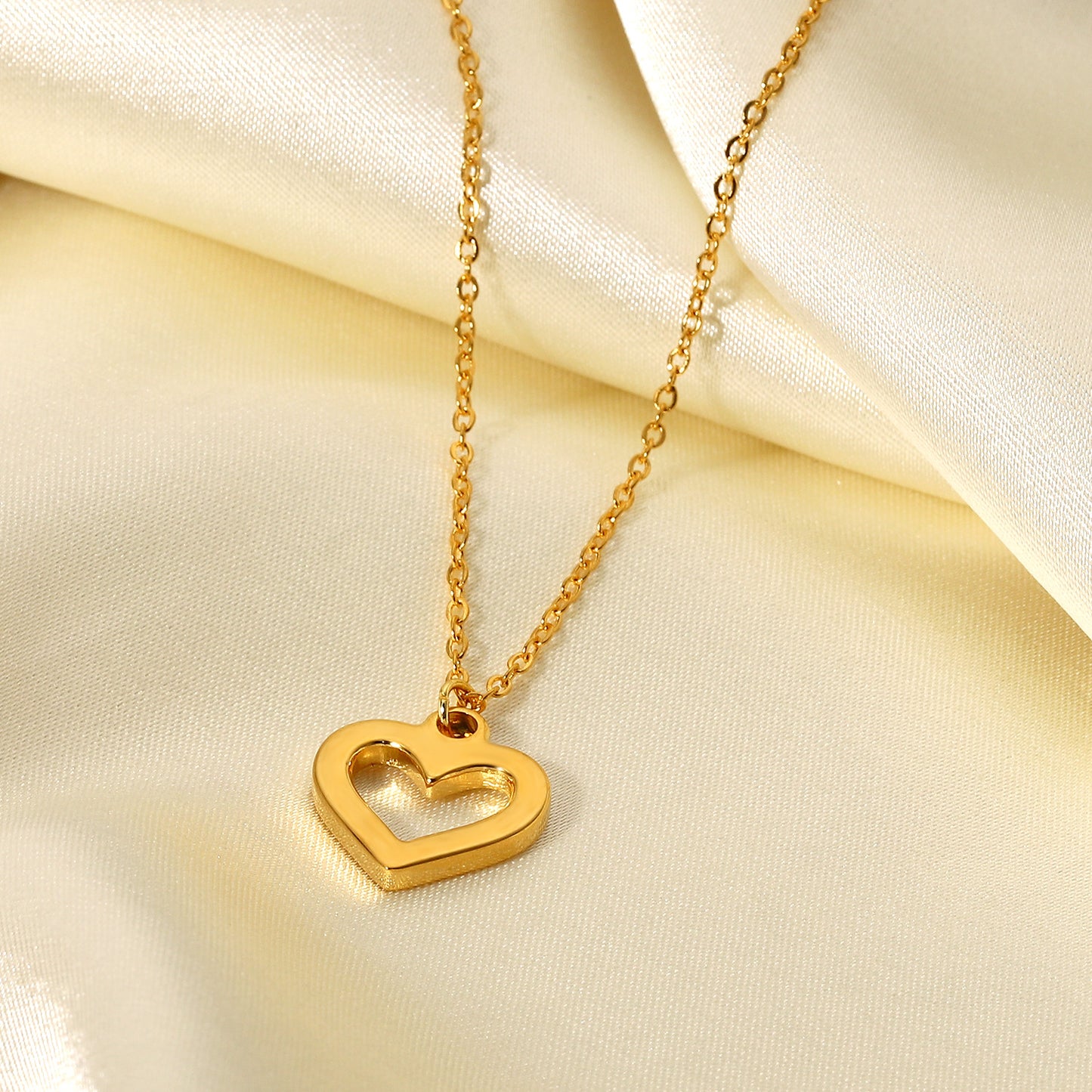 Ins Style Heart Shaped Stainless Steel Necklace with Vacuum Plated 18K Gold Finish and Hollow Design Featuring Clear Zirconia Accents for Women