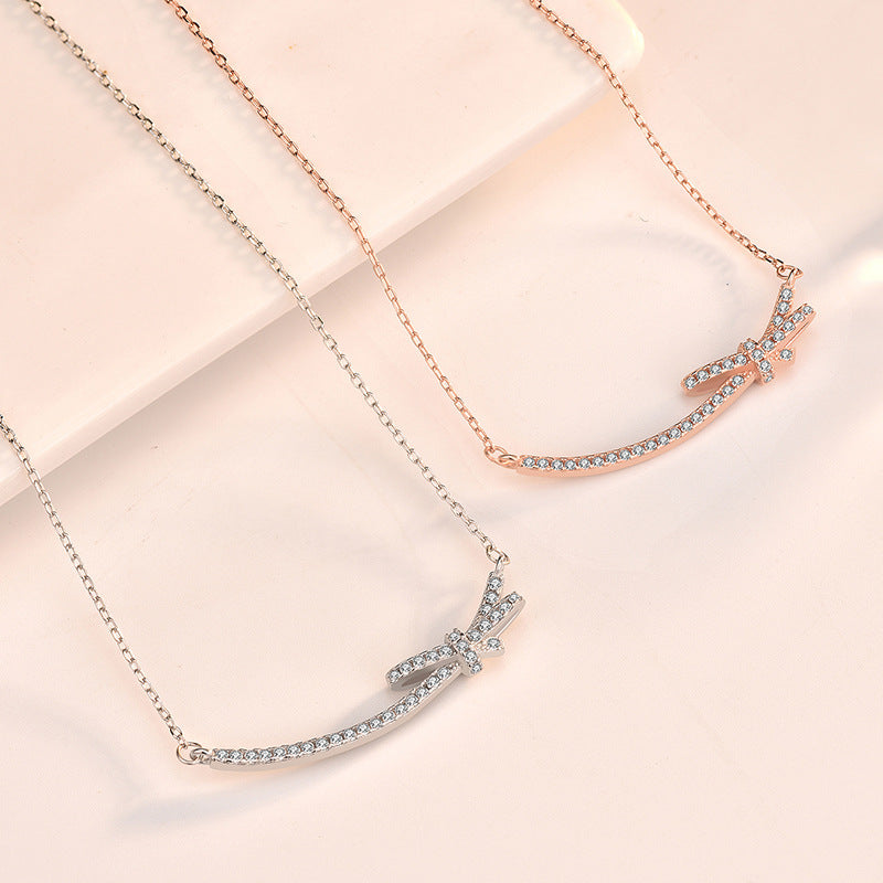 Minimalist Bow-Shaped Titanium Steel Necklace for Women with Alloy Pendant and Cross Chain Design