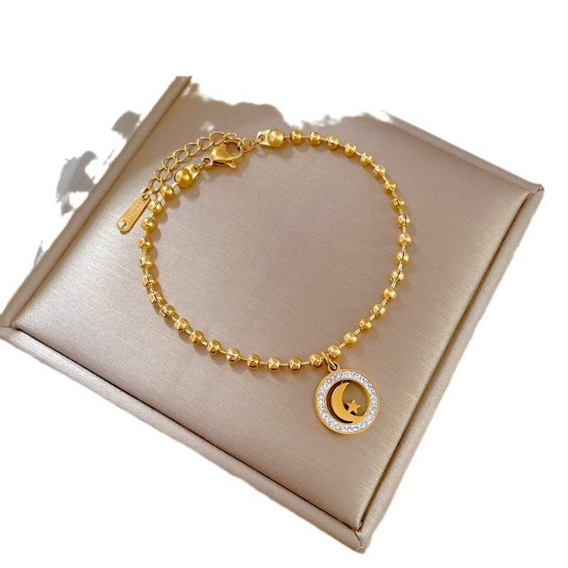 Bracciale Pendente Vintage Stella e Luna da Donna in Acciaio al Titanio Placcato Oro con Perline