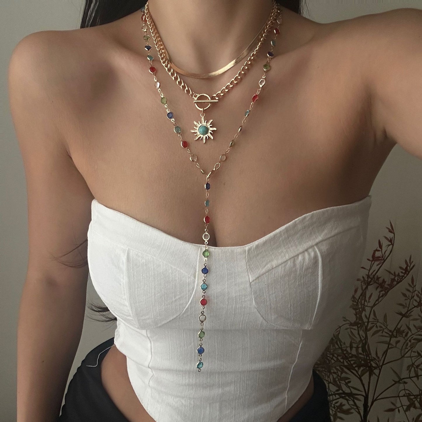 Collana da donna multistrato con nappine a girasole, in lega geometrica e cristallo