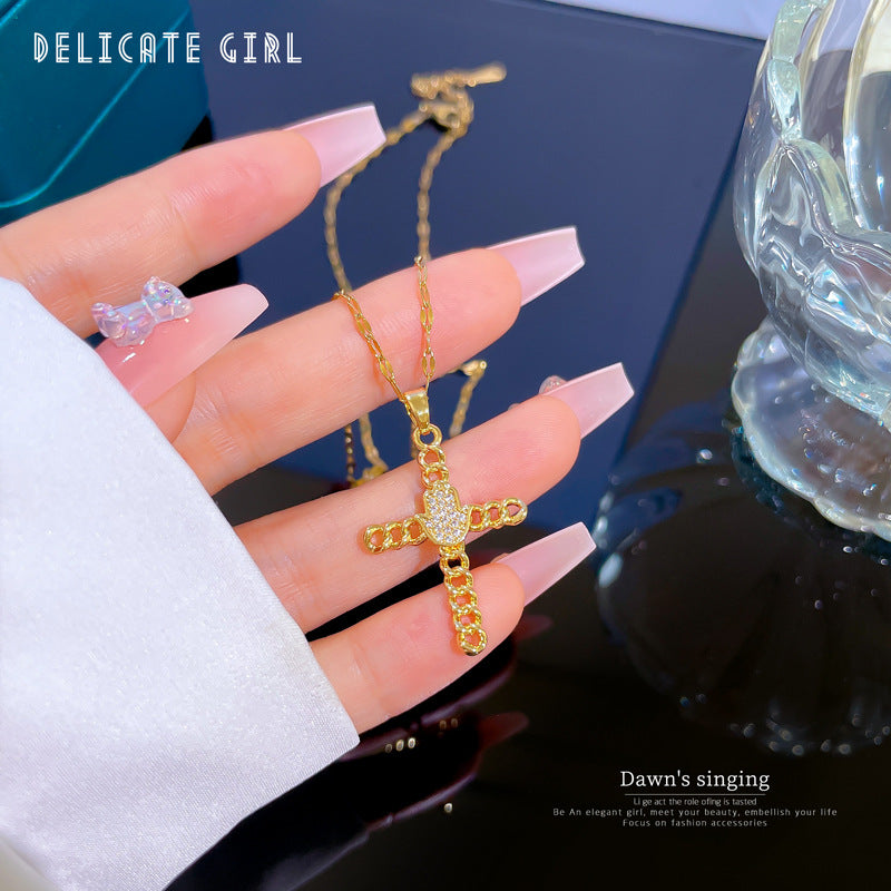 Collana Pendente a Croce Geometrica Esotica da Donna in Acciaio al Titanio con Intarsio di Zirconi e Placcatura in Oro