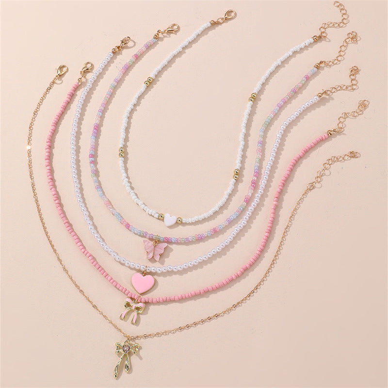 Simpatica collana per bambini con perline di vetro a forma di fiocco e ciondolo in lega su catena di perline rotonde per bambini dai 3 ai 10 anni