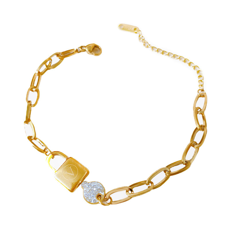 Minimalist Gold Plated Titanium Steel Key and Letter V Pendant with Cubic Zirconia