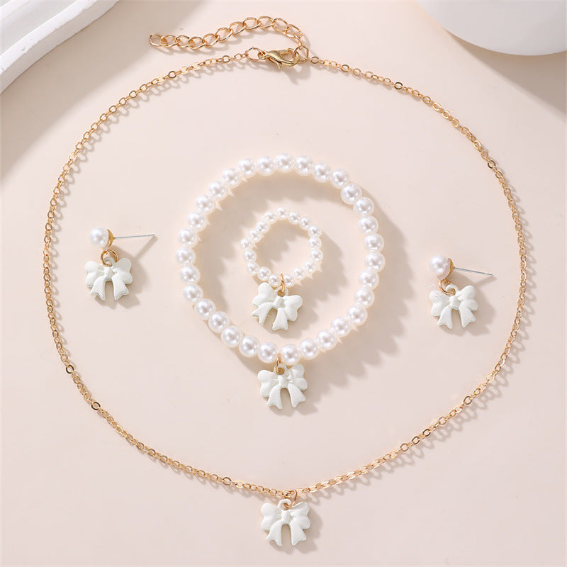 Conjunto de collar y pulsera de perlas dulces con colgante de lazo para niños en material de resina con acabado esmaltado