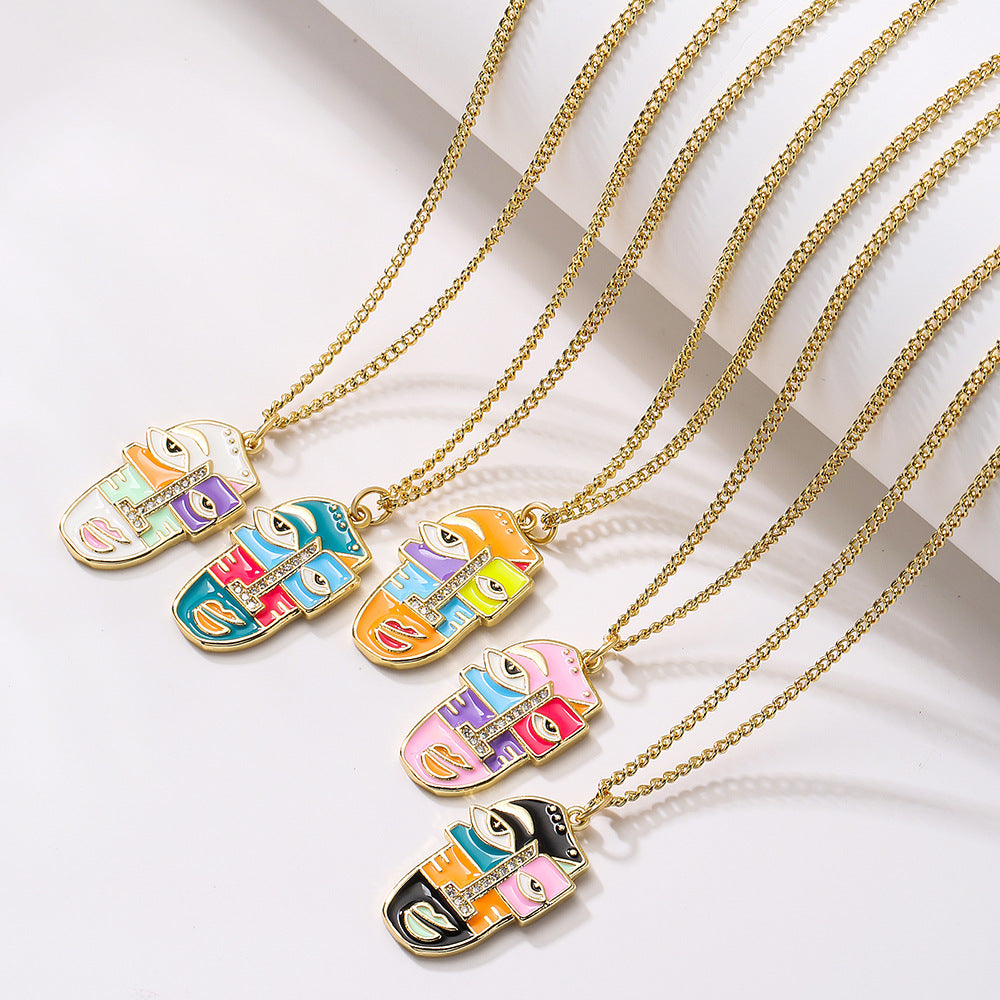 Abstract Face Pendant Necklace for Women in Copper with 18K Gold Plating Rhinestone Inlay and Enamel Finish