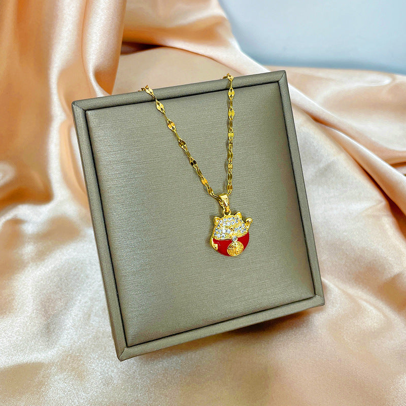 Collana con ciondolo girevole a quadrifoglio in acciaio al titanio con zirconi micropavé da donna