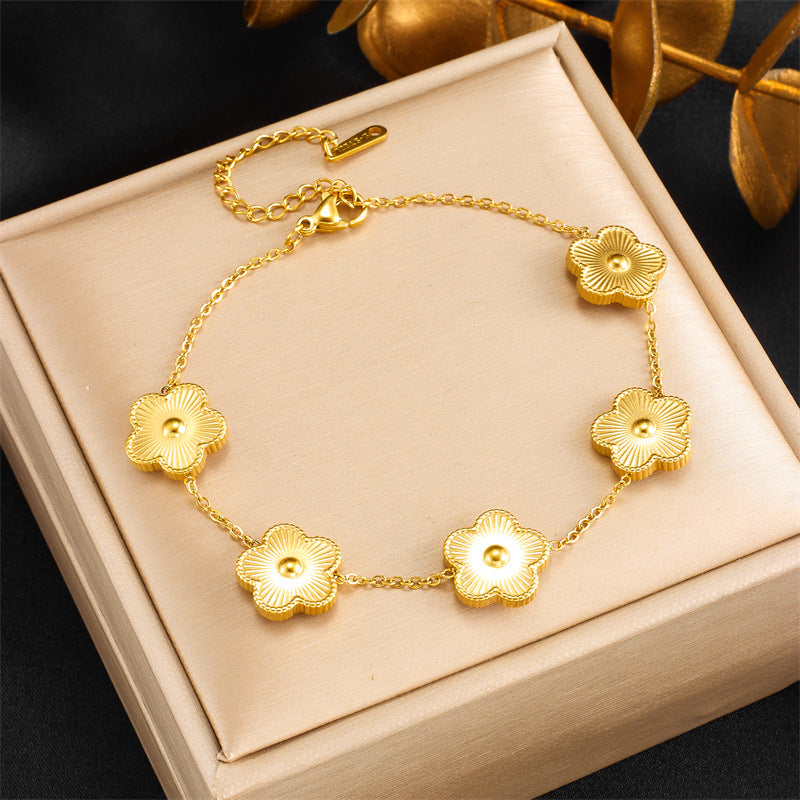 Bracciale da donna in acciaio al titanio placcato oro con motivo floreale alla moda