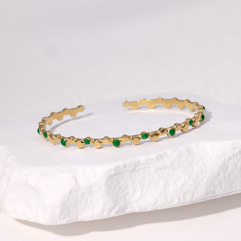 Bracciale rigido aperto in acciaio inossidabile placcato oro 18K con pois geometrici minimalisti alla moda