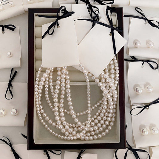 Elegant French-Inspired Pearl Necklace for Women with U-Shaped Pendant, Imitation Pearl and Mother-of-Pearl Accents, Plated Finish, Delicate Clavicle Chain