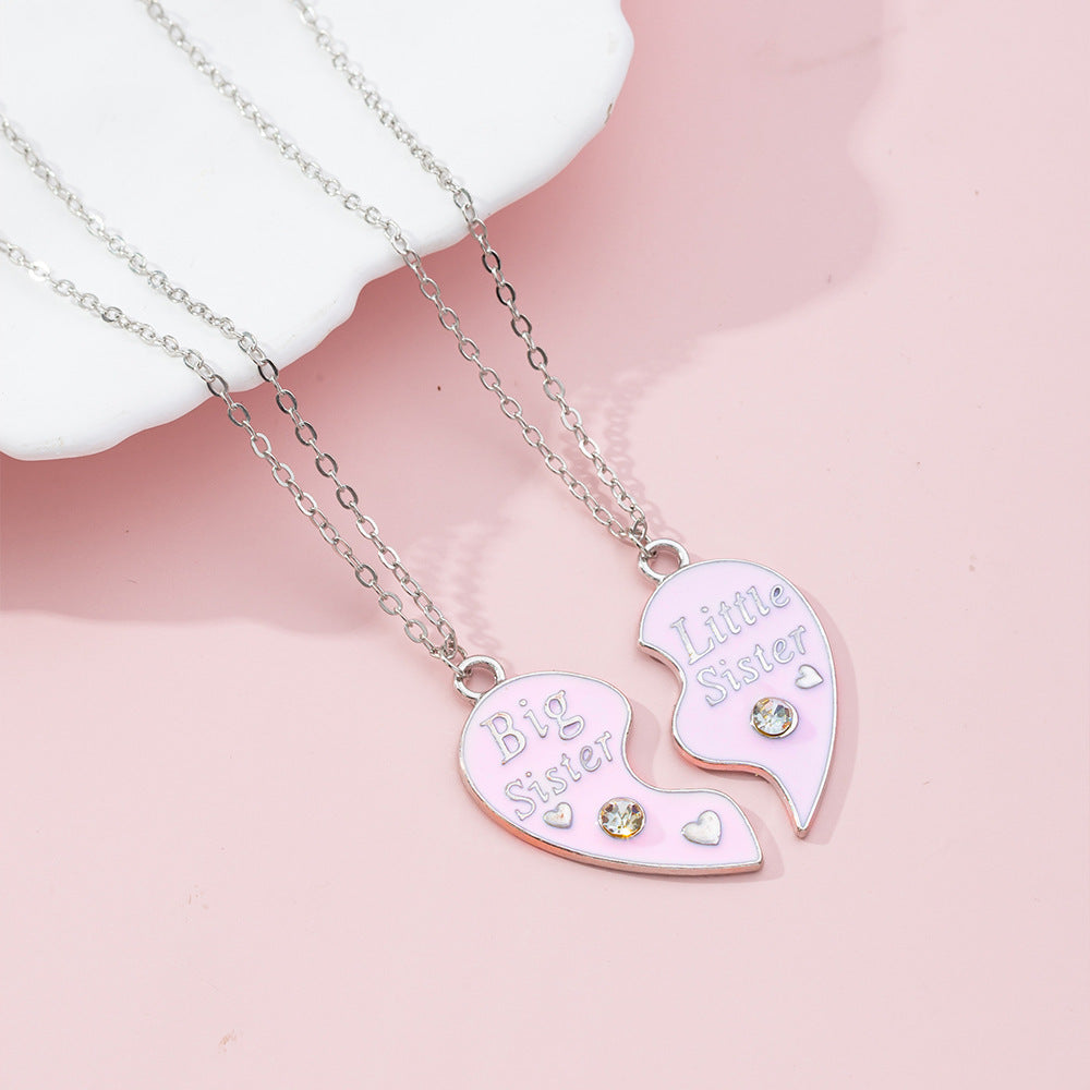 Lindo collar con dije de Stitch de dibujos animados para niños en aleación con acabado de esmalte y dije en forma de corazón en cadena cruzada