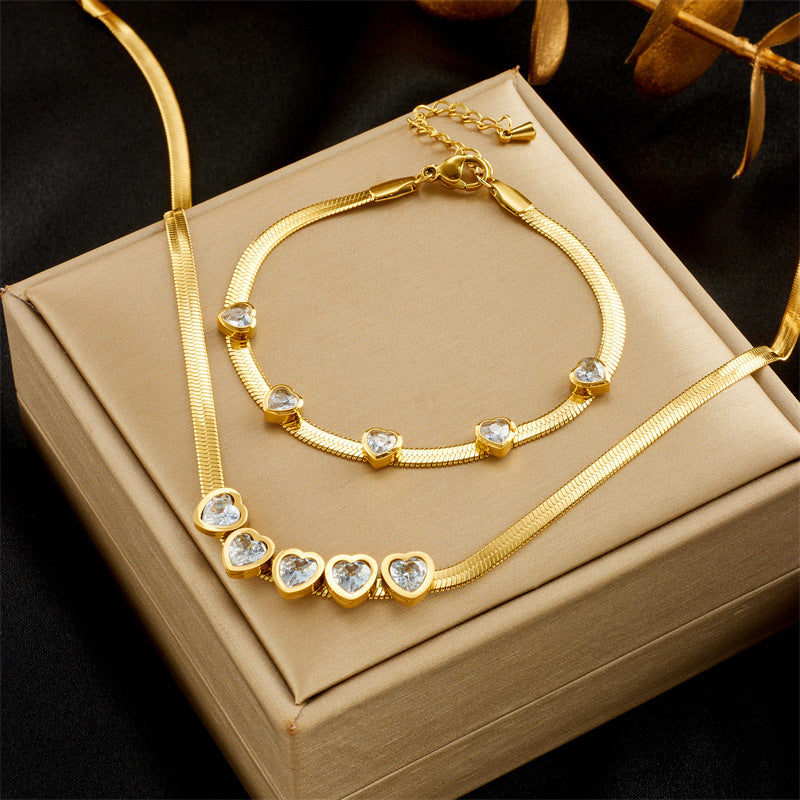Juego de collar y pulsera minimalistas de acero de titanio con forma de corazón y cadena de serpiente con detalles de pedrería