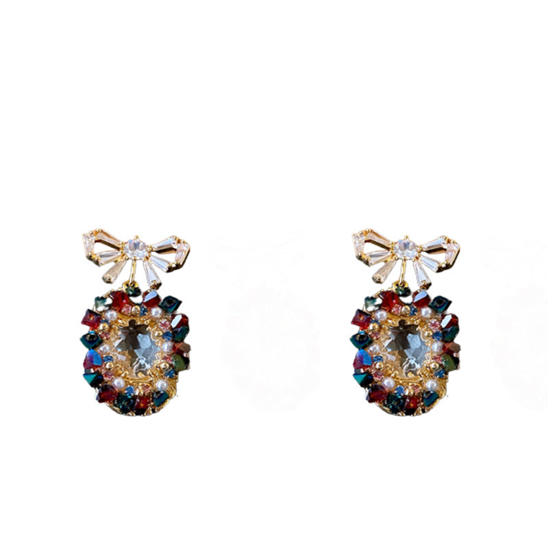 Elegantes pendientes de perlas y circonitas con forma ovalada y lazo en acero inoxidable para mujer