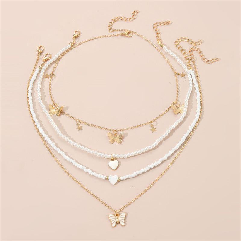 Bonito collar con dije de aleación esmaltado en forma de corazón para niños con cadena de eslabones torcidos