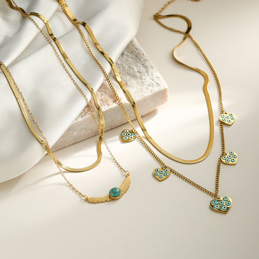 Collana da donna a doppio strato con catena alla clavicola in acciaio al titanio e ciondolo a forma di occhio geometrico smaltato minimalista