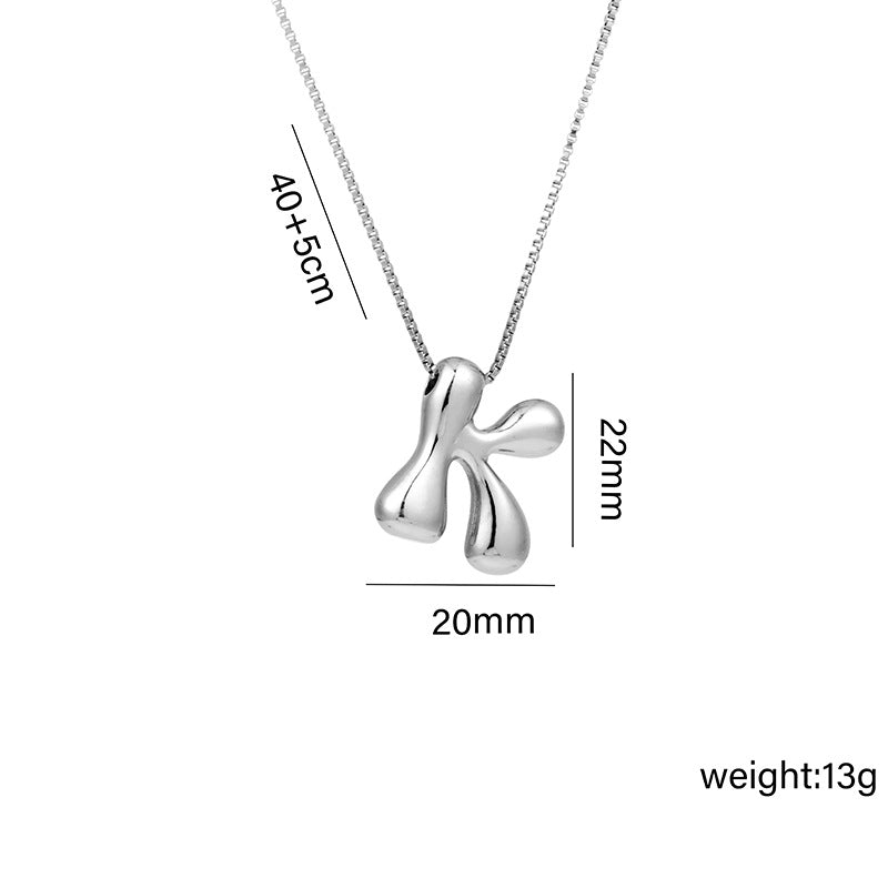 Collar con colgante de acero titanio con forma de letra minimalista y chapado en oro para mujer