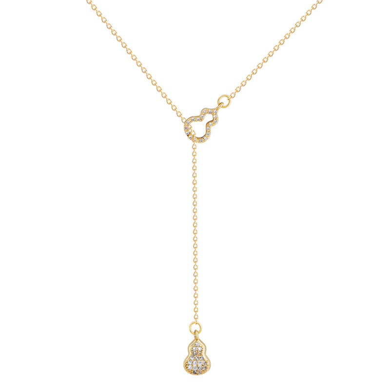 Collana con pendente a zucca cava elegante e minimalista da donna in acciaio al titanio con finitura placcata e catena a croce